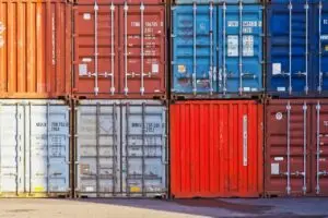 Colorful stacked shipping containers in a freight yard