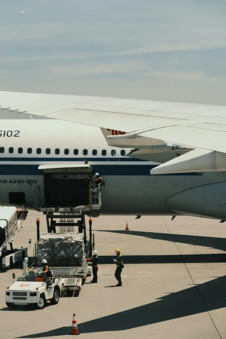 freight shipping services loading cargo into airplane for international delivery